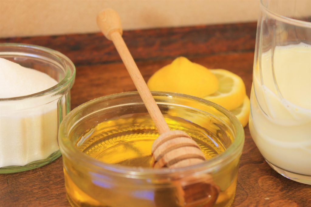 honey, sugar, lemon and milk to use in tea