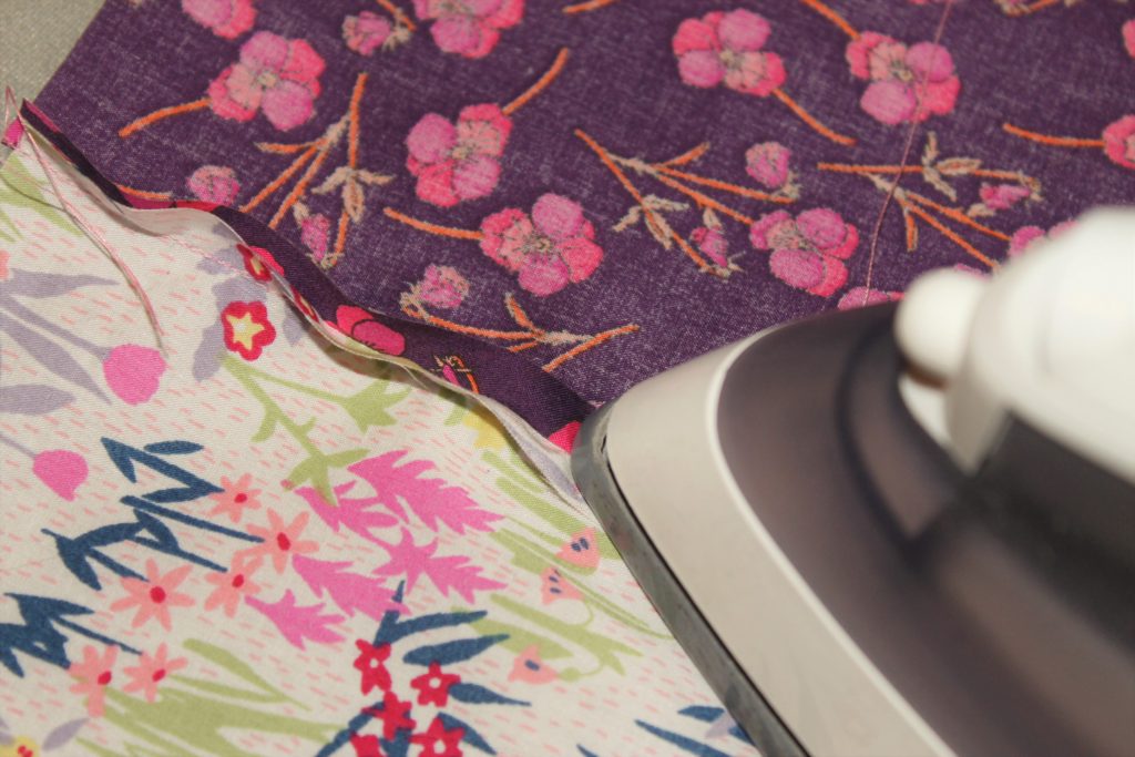 ironing pink quilt seams