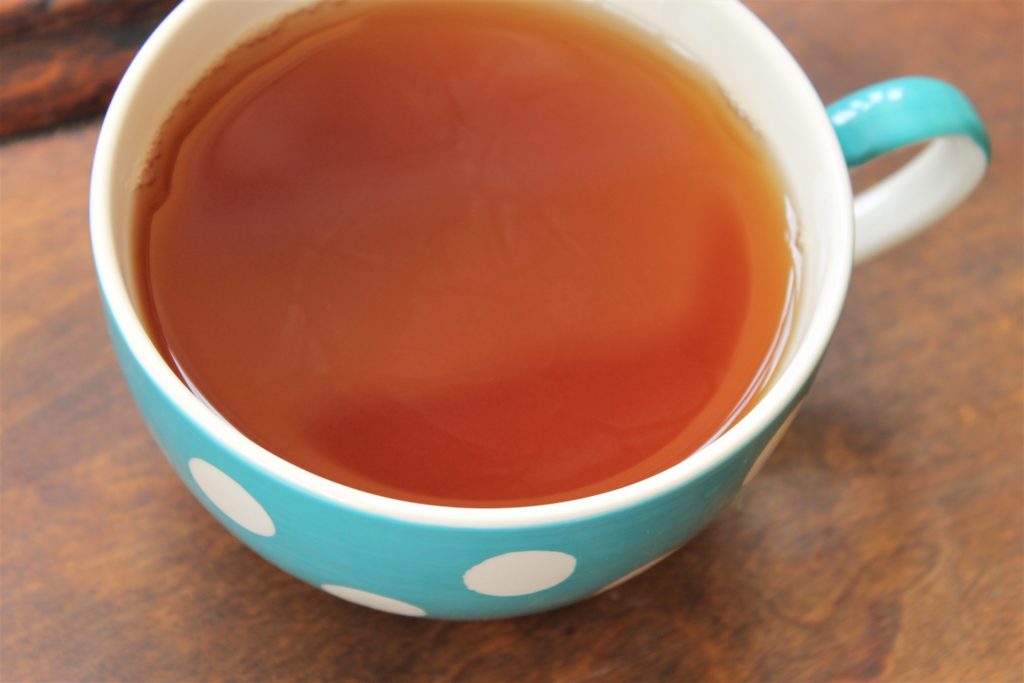 polka dot mug with lemon tea inside