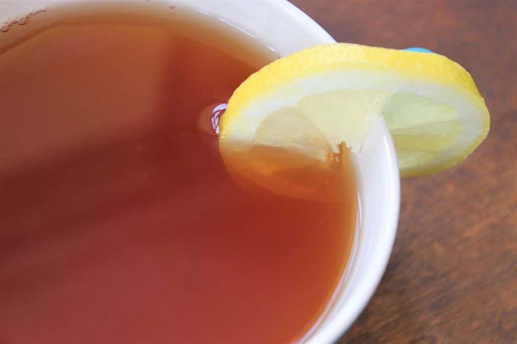 brown tea with lemon slice
