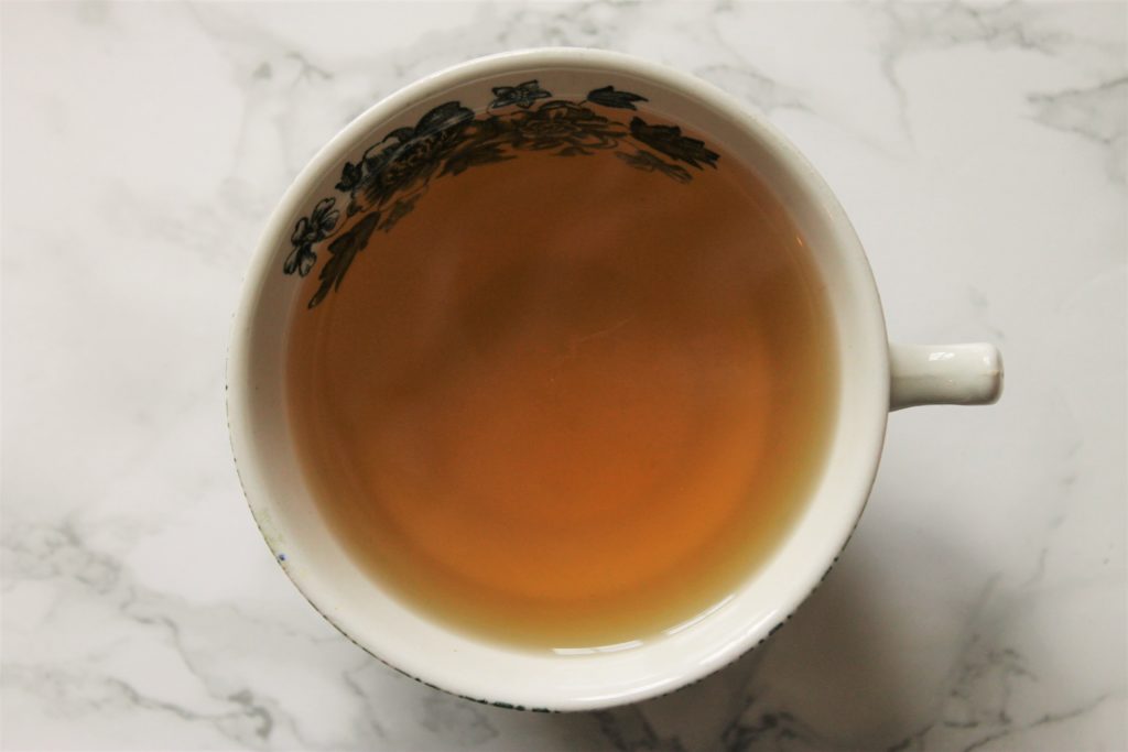 yellow orange tea in cup