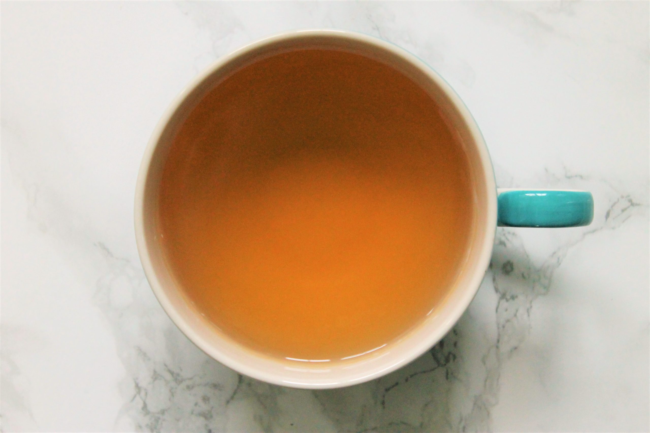 orange tea in teacup