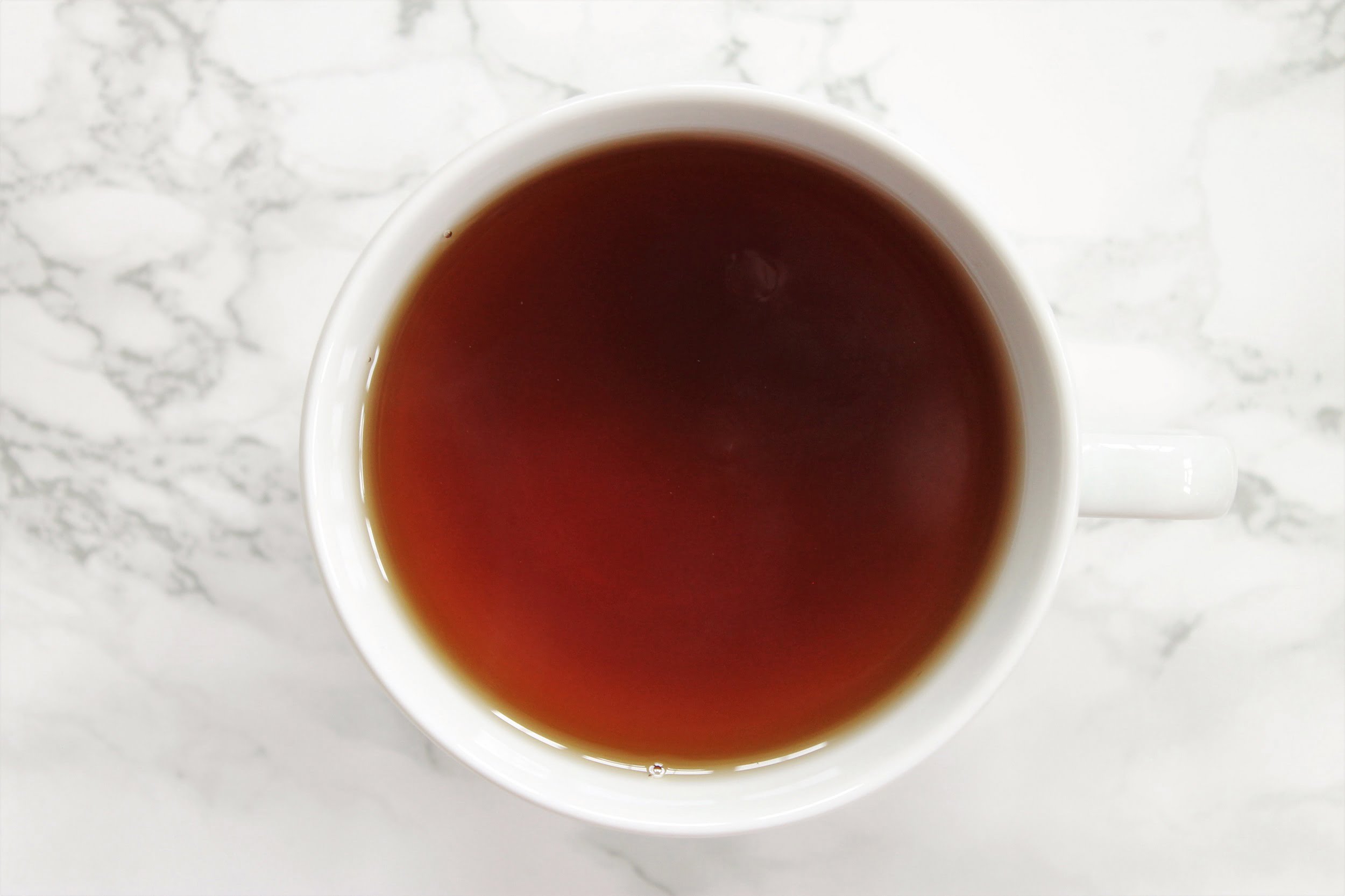 black tea in white teacup