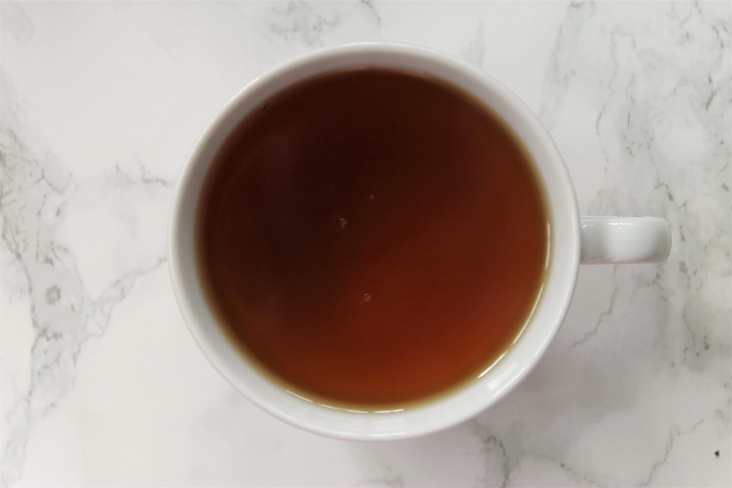ceylon black tea in white teacup