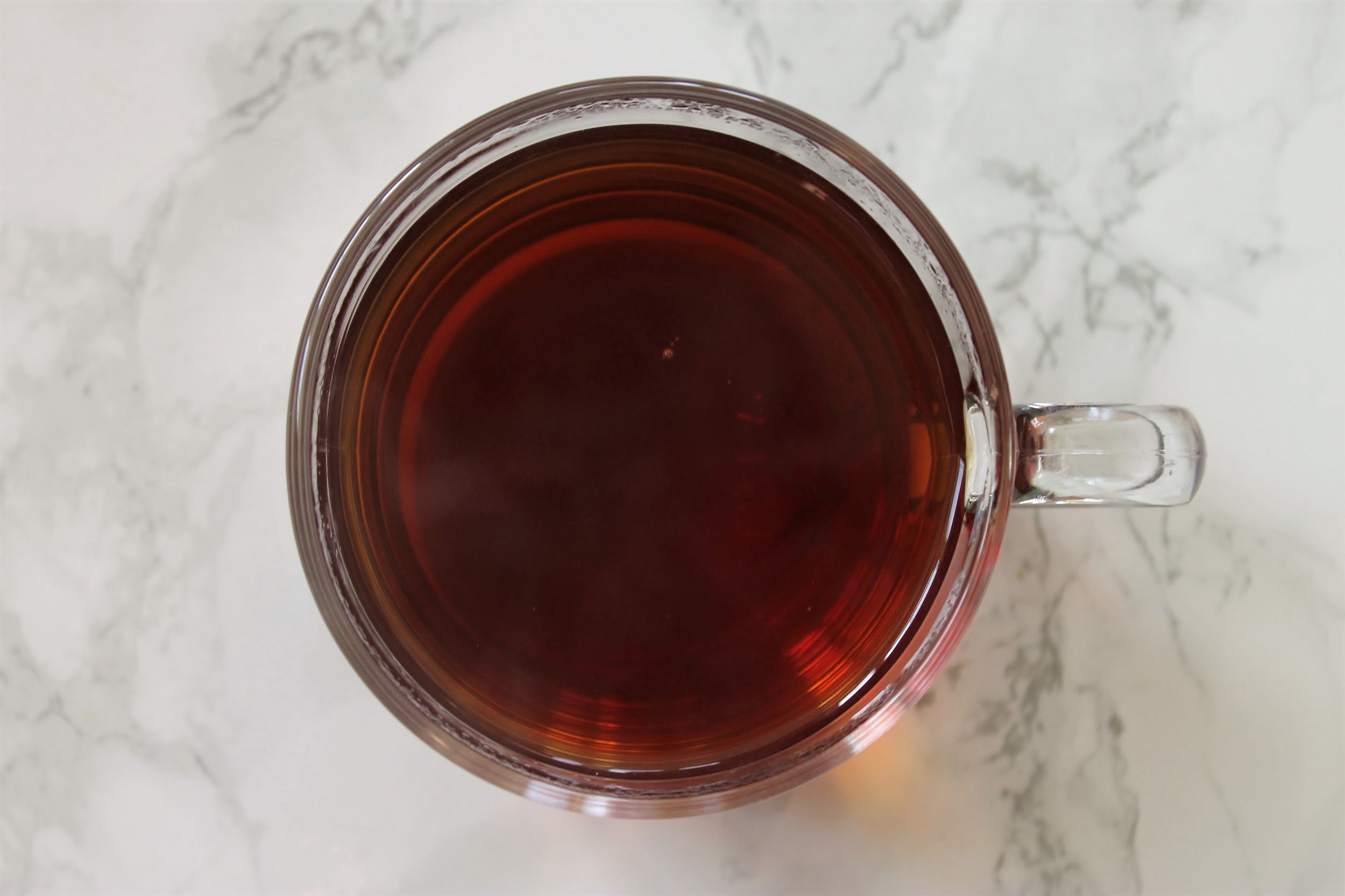 amber black tea in glass teacup