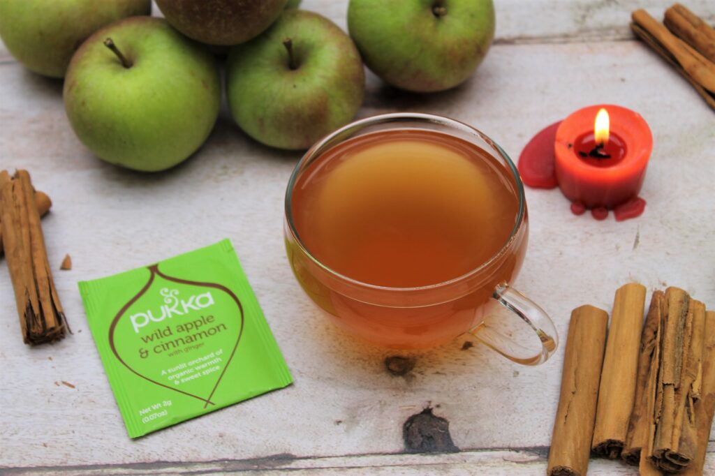 apple and cinnamon tea in teacup