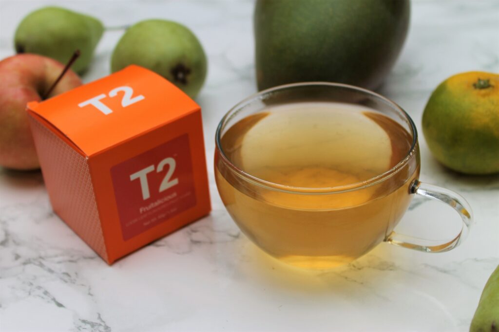 t2 fruitalicious surrounded by tropical fruit